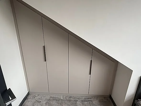 Under-stairs fitted storage by Downes Fitted Furniture
